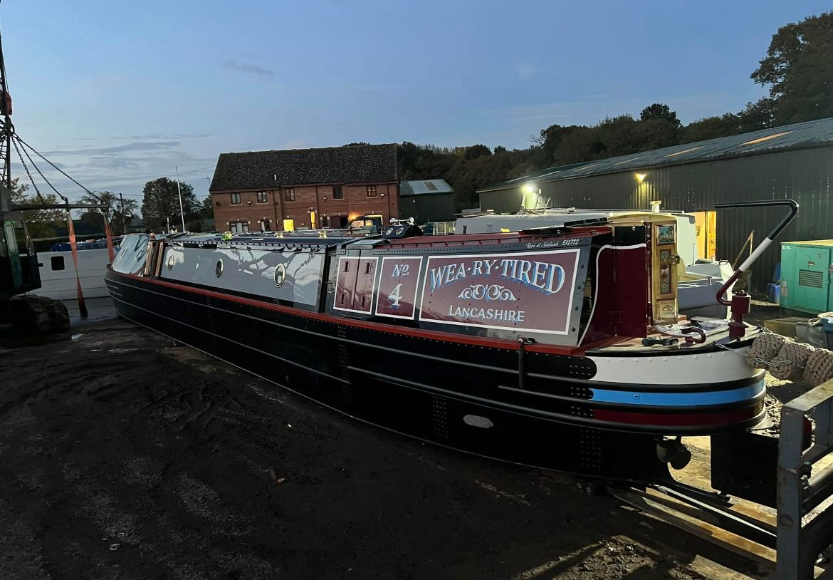 Weary Tired Lancashire narrowboat with finished maroon grey and black paintwork at Teddesley Boat Yard
